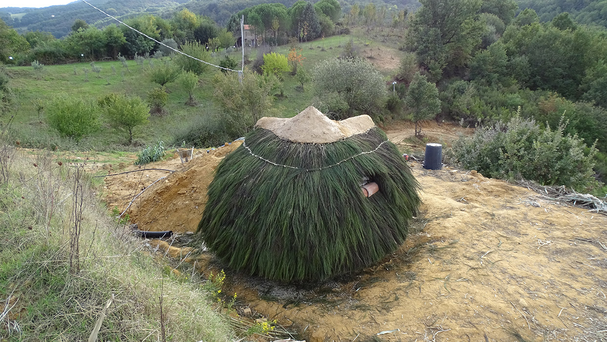 superadobe earthbag dome and broom thatched roof