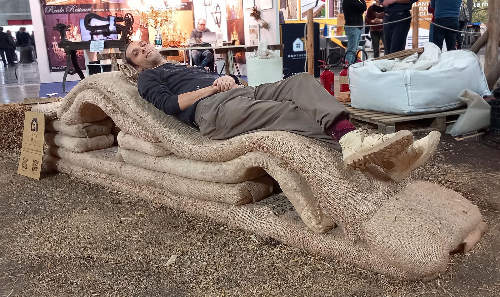 man sitting on earth and jute chaiselong