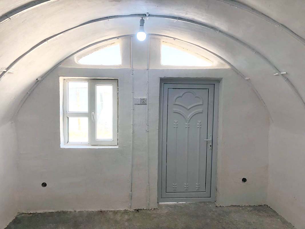 superadobe earth vault in refugee camp