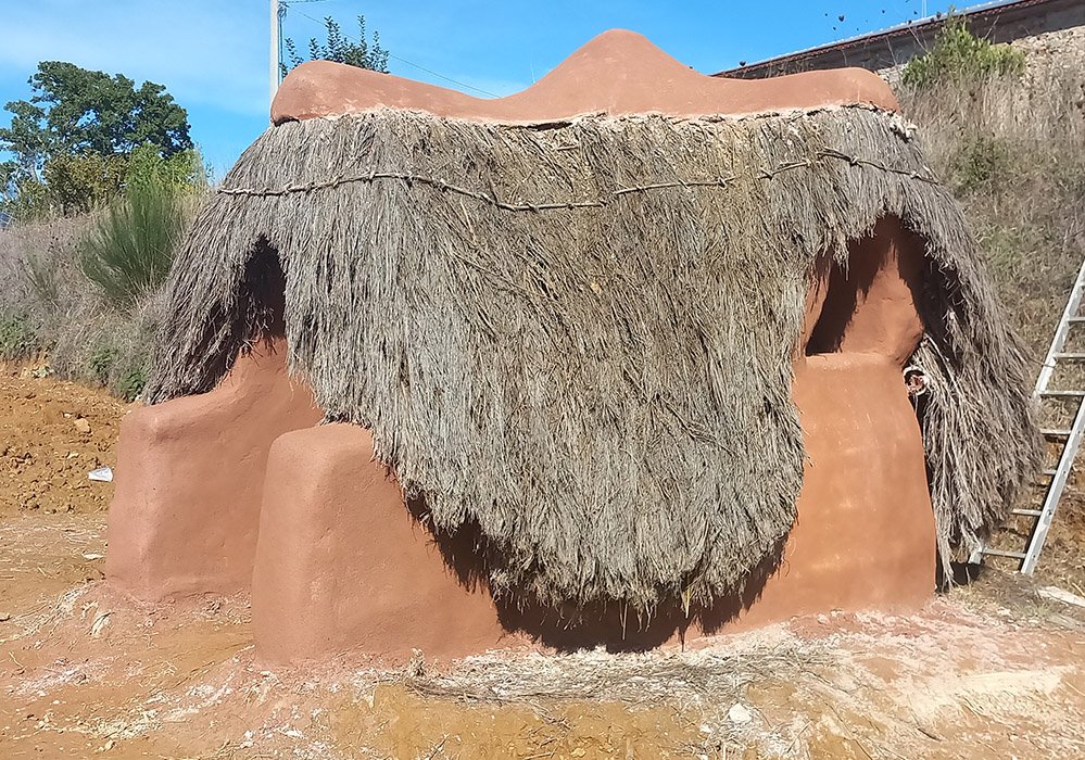 earth architecture and thatched roof